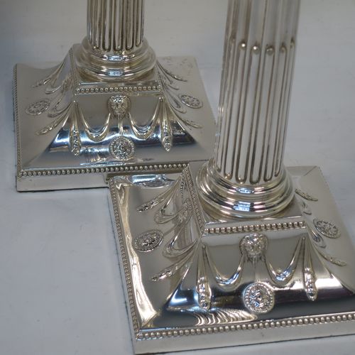 A very handsome set of four Antique Victorian Silver Plated table candlesticks, in a Neoclassical Corinthian style having square stepped bases with swag and lion-mask decoration, fluted columns, laurel leaf swag capitals, removable nozzles, and bead-edged borders. Made by Hawksworth Eyre and Co., of Sheffield in ca. 1880. The dimensions of this fine hand-made set of four antique silver-plated candlesticks are height 26 cms (10.25 inches), and their bases are 11 cms (4.3 inches) square.