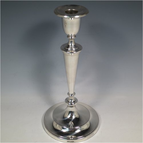 An Antique Victorian Sterling Silver set of four large table candlesticks, in a plain round style, having round bodies with hand-chased reeded borders, tapering columns, and removable nozzles. Made by Elkington & Co., of Sheffield in 1899. The dimensions of these fine hand-made antique silver candlesticks are height 29 cms (11.5 inches), and diameter at bases 14 cms (5.5 inches).   