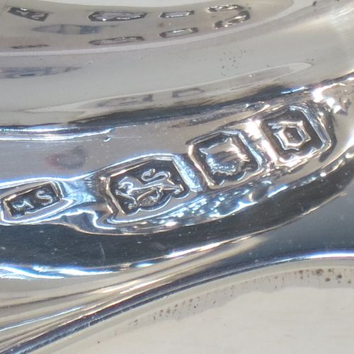 A very bold antique Sterling Silver pair of Sabbath candlesticks, having round baluster bodies with hand-chased floral decoration, shaped square bases, and removable nozzles. Made by Morris Salkind of London in 1919. The dimensions of these fine hand-made antique silver Sabbath candlesticks are height 36 cms (14 inches), base 14 cms (5.5 inches) square, and they weigh a total of approx. 1,008g (32.5 troy ounces). Please note that these candlesticks are not filled.