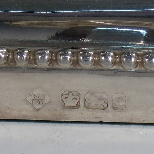 An Antique Victorian Sterling Silver pair of very pretty table candlesticks with bead-edged borders, having square bases with straight hexagonal panelled columns, with plain round capitals and removable nozzles. Made by Martin Hall and Co., of Sheffield in 1897. The dimensions of this fine hand-made pair of antique silver candlesticks are height 23 cms (9 inches), and 11 cms (4.3 inches) square at the base.