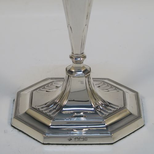 A very elegant Antique Victorian Sterling Silver pair of candlesticks, having octagonal bodies with hand-chased fluted decoration, reed-edged borders, and removable nozzles. These handsome antique silver candlesticks were made by Martin & Hall of Sheffield in 1901. The dimensions of these fine hand-made antique silver candlesticks are height 18.5 cms (7.25 inches), and the bases are 10 cms (4 inches) long, by 8 cms (3 inches) wide.