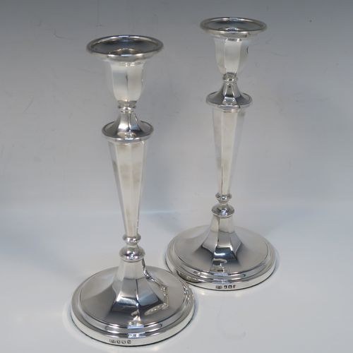 An elegant Sterling Silver pair of candlesticks, having plain octagonal bodies, sitting on round bases, and round removable nozzles. These handsome silver candlesticks were made by Roberts and Belk of Sheffield in 1972. The dimensions of these fine hand-made silver candlesticks are height 21 cms (8.25 inches), and the bases are 9.5 cms (3.75 inches) in diameter.
   