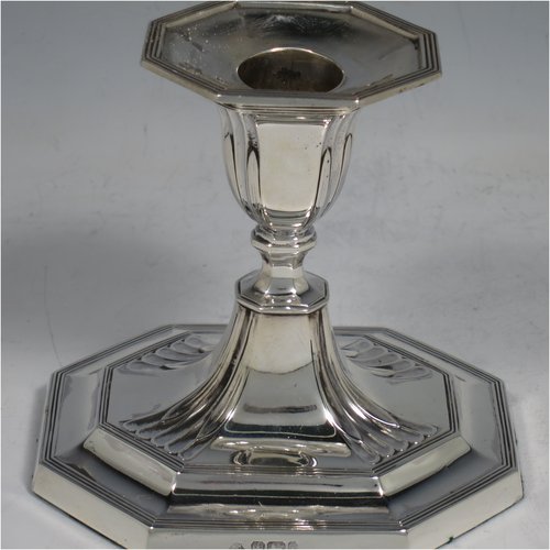 An Antique Victorian Sterling Silver pair of small candlesticks, having octagonal bases with hand-chased fluted decoration, reed-edged borders, and removable nozzles. Made by Martin & Hall of Sheffield in 1901. The dimensions of these fine hand-made antique silver candlesticks are height 10 cms (4 inches), and the bases are 11 cms (4.3 inches) long, by 8.5 cms (3.3 inches).