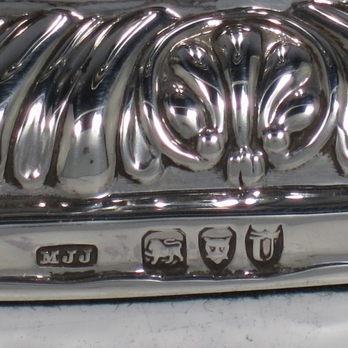 An Antique Victorian Sterling Silver pair of candlesticks, in a Georgian Regency style with plain round columns on square bases with rounded corners, gadroon edged borders, and removable nozzles. Made by Matthew John Jessop of London in 1895. The dimensions of this fine pair of hand-made silver candlesticks are height 14 cms (5.5 inches), and the bases are 9 cms (3.5 inches) square.