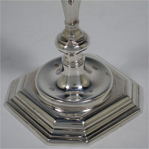 A very handsome Sterling Silver pair of cast candlesticks in a George I style, having octagonal baluster bodies, and sitting on hexagonal bases. Made in London in 1992. The dimensions of these fine hand-made cast silver table candlesticks are height 17 cms (6.75 inches), and the bases are 10 cms (4 inches) square.