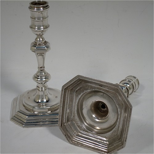 A very handsome Sterling Silver pair of cast candlesticks in a George I style, having octagonal baluster bodies, and sitting on hexagonal bases. Made in London in 1992. The dimensions of these fine hand-made cast silver table candlesticks are height 17 cms (6.75 inches), and the bases are 10 cms (4 inches) square.