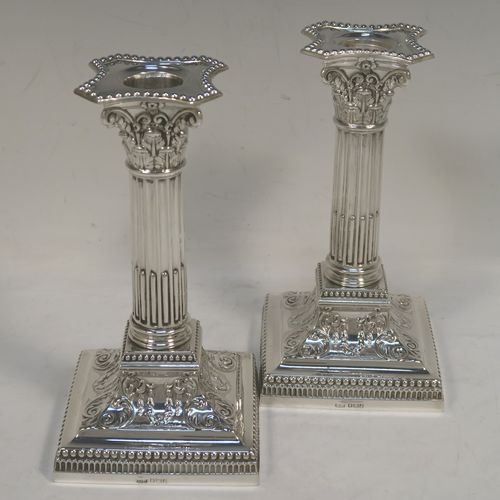 A very pretty pair of Antique Edwardian Sterling Silver of Corinthian style candlesticks, having bead-edged borders, acanthus-leaf capitals, fluted columns, removable nozzles, and square stepped bases. These beautiful antique silver candlesticks were made by James Dixon and Sons of Sheffield in 1907. The dimensions of this fine hand-made pair of antique silver candlesticks are height 17 cms (6.75 inches), and the bases are 9 cms (3.5 inches) square.   