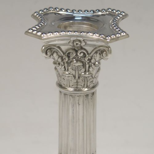 A very pretty pair of Antique Edwardian Sterling Silver of Corinthian style candlesticks, having bead-edged borders, acanthus-leaf capitals, fluted columns, removable nozzles, and square stepped bases. These beautiful antique silver candlesticks were made by James Dixon and Sons of Sheffield in 1907. The dimensions of this fine hand-made pair of antique silver candlesticks are height 17 cms (6.75 inches), and the bases are 9 cms (3.5 inches) square.