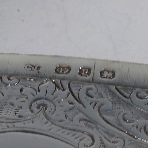 A very pretty Antique Victorian Sterling Silver calling card case, having a rectangular body with rounded shoulders, hand-engraved floral decoration, a vacant central cartouche on one side, and a side-hinged lid. Made by George Loveridge of Birmingham in 1898. The dimensions of this fine hand-made antique silver card case are length 10 cms (4 inches), width 7.5 cms (3 inches), and it weighs approx. 88g (2.8 troy ounces).