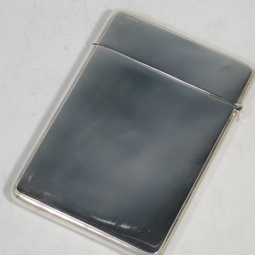 A very pretty Antique Sterling Silver calling card case, having a rectangular body with rounded shoulders, hand-engraved neoclassical style floral decoration on the front with a plain undecorated rear side, and a side-hinged lid. Made by Crisford and Norris Ltd., of Birmingham in 1913. The dimensions of this fine hand-made antique silver card case are length 10 cms (4 inches), width 7 cms (2.75 inches), and it weighs approx. 67g (2.2 troy ounces).