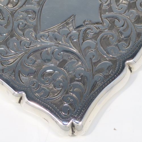 A very pretty Antique Sterling Silver calling card case, having a shaped rectangular body with hand-engraved floral and scroll decoration, a vacant central cartouche on one side, and a side-hinged lid. This beautiful silver card case was made by Smith and Bartlam of Birmingham in 1918. The dimensions of this fine hand-made antique silver card case are length 10 cms (4 inches), width 7 cms (2.75 inches), and it weighs approx. 69g (2.2 troy ounces).