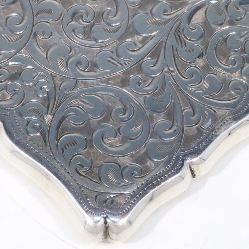 A very pretty Antique Sterling Silver calling card case, having a shaped rectangular body with hand-engraved floral and scroll decoration, a vacant central cartouche on one side, and a side-hinged lid. This beautiful silver card case was made by Smith and Bartlam of Birmingham in 1918. The dimensions of this fine hand-made antique silver card case are length 10 cms (4 inches), width 7 cms (2.75 inches), and it weighs approx. 69g (2.2 troy ounces).