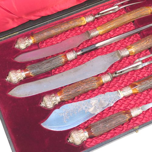 A very handsome, large, and complete seven-piece Antique Victorian Silver Plated and deer antler horn meat carving set with fish servers, consisting of two forks with working guards, two knives, one sharpening steel, one fish serving fork fork, and one fish knife with hand-engraved gingko and fern leaves, all with bone antler handles and silver ferrules with hand-chased fluting and floral decoration, all in their original maroon velvet and crimson silk lined presentation box. This beautiful original carving set was made in ca. 1895 with a design registration mark. The dimensions of this fine hand-made antique silver and antler bone handled carving set are length of longest knife 39 cms (15.3 inches), and length of forks 29 cms (11.5 inches).