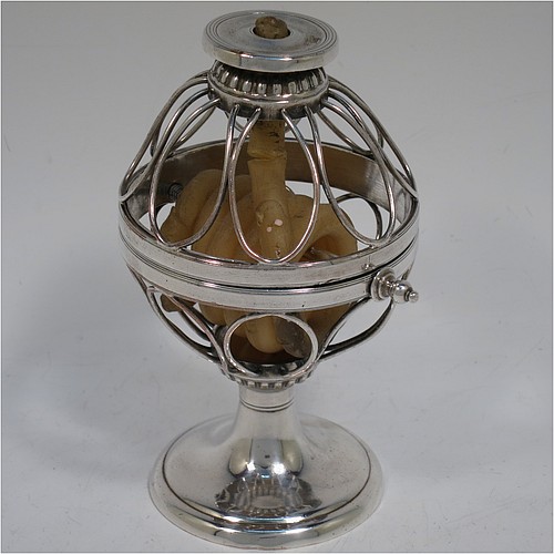 An Antique Georgian Old Sheffield Silver Plated wax-jack chamber-stick in a globe style, having a coiled wax mounted in a spherical boy with a wire-work frame, sitting on a plain round pedestal foot, with hand-chased reeded borders, all in original condition. Made in ca. 1800. The dimensions of this fine hand-made antique Old Sheffield silver-plated waxjack chamberstick are height 13.5 cms (5.5 inches), and diameter 7.5 cms (3 inches).