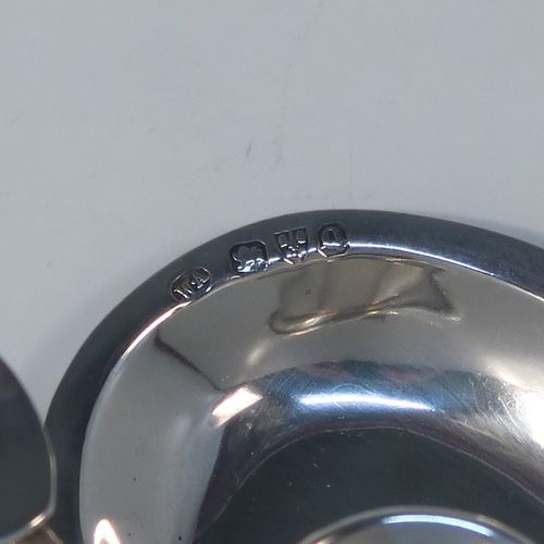 A very pretty Antique Victorian Sterling Silver miniature chamber-stick, having a plain heart-shaped body, with a ring handle and heart-shaped thumb-piece, a plain round fixed nozzle, and sitting on a flat base. This unusual heart-shaped silver chamberstick was made by William Aitkens of Chester in 1899. The dimensions of these fine hand-made antique silver miniature chamberstick are length 10 cms (4 inches), width 9.5 cms (3.75 inches), height 4 cms (1.5 inches), and it weighs approx. 52g (1.7 troy ounces).