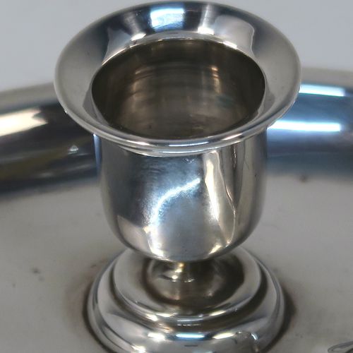 A very pretty Antique Victorian Sterling Silver miniature chamber-stick, having a plain heart-shaped body, with a ring handle and heart-shaped thumb-piece, a plain round fixed nozzle, and sitting on a flat base. This unusual heart-shaped silver chamberstick was made by William Aitkens of Chester in 1899. The dimensions of these fine hand-made antique silver miniature chamberstick are length 10 cms (4 inches), width 9.5 cms (3.75 inches), height 4 cms (1.5 inches), and it weighs approx. 52g (1.7 troy ounces).