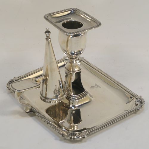 A handsome Antique Georgian Sterling Silver Regency style chamberstick, having a rectangular body with a gadroon & shell border, a side-handle with original removable snuffer, and an original drip-pan nozzle. This elegant antique silver chamberstick was made by Peter and William Bateman of London in 1812. The dimensions of this fine hand-made silver chamberstick are height 11 cms (4.25 inches), length 16 cms (6.25 inches), width 12.5 cms (5 inches), and with a total weight of approx. 352g (11.4 troy ounces). Please note that this item is part crested.