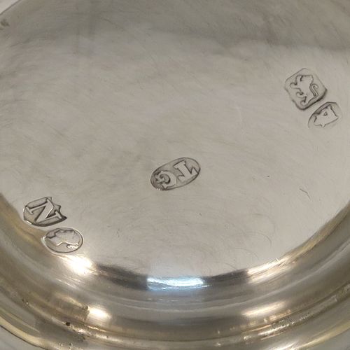 A very pretty Antique Victorian Sterling Silver christening mug, having a round body with straight tapering sides and tucked under belly, with hand-engraved ferns and gingko leaves decoration, a plain loop handle, and all sitting on a pedestal foot. This beautiful silver christening mug was made by Thomas Goodfellow of London in 1888. The dimensions of this fine hand-made antique silver christening mug are height 9.5 cms (3.75 inches), diameter at lip 6 cms (2.25 inches), and it weighs approx. 147g (4.7 troy ounces).  