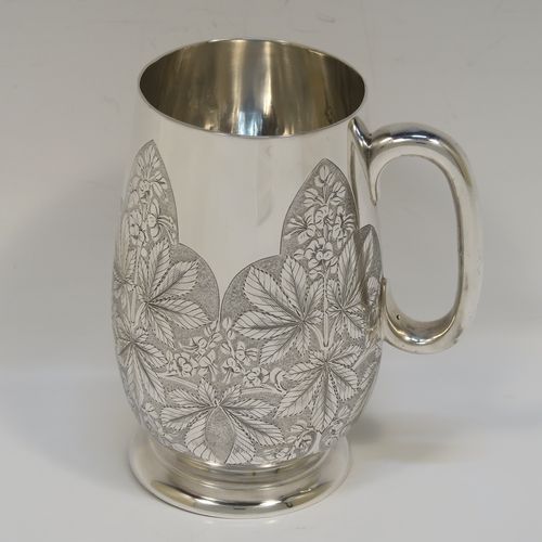 A really beautiful Antique Victorian Sterling Silver christening mug, having a round body with straight tapering sides and tucked under belly, with hand-engraved ferns floral decoration, a plain loop handle, and all sitting on a pedestal foot. This fantastic silver christening mug was made Stephen Smith of London in 1873. The dimensions of this fine hand-made antique silver christening mug are height 11 cms (4.25 inches), diameter at lip 6 cms (2.25 inches), and it weighs approx. 182g (5.9 troy ounces).