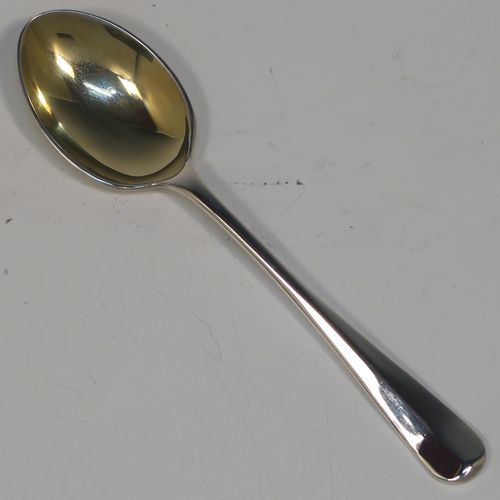 A handsome Sterling Silver three-piece christening set, consisting of a plain round napkin ring, a plain round egg cup with applied floral and scroll borders and a gold-gilt interior, and a plain Hanoverian pattern spoon with a gold-gilt bowl, all in their original cream satin and black velvet-lined presentation box. This elegant christening set was made by Turner and Simpson Birmingham in 1960 (the napkin ring was made by Henry Matthews of Birmingham in 1935). The dimensions of this fine hand-made silver christening set are length of spoon 10 cms (4 inches), diameter of napkin ring 4.5 cms (1.75 inches), height of egg cup 6.5 cms (2.75 inches), and the total weight is approx. 56g (1.8 troy ounces).
