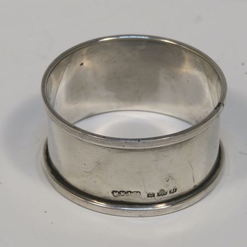 A handsome Sterling Silver three-piece christening set, consisting of a plain round napkin ring, a plain round egg cup with applied floral and scroll borders and a gold-gilt interior, and a plain Hanoverian pattern spoon with a gold-gilt bowl, all in their original cream satin and black velvet-lined presentation box. This elegant christening set was made by Turner and Simpson Birmingham in 1960 (the napkin ring was made by Henry Matthews of Birmingham in 1935). The dimensions of this fine hand-made silver christening set are length of spoon 10 cms (4 inches), diameter of napkin ring 4.5 cms (1.75 inches), height of egg cup 6.5 cms (2.75 inches), and the total weight is approx. 56g (1.8 troy ounces).
