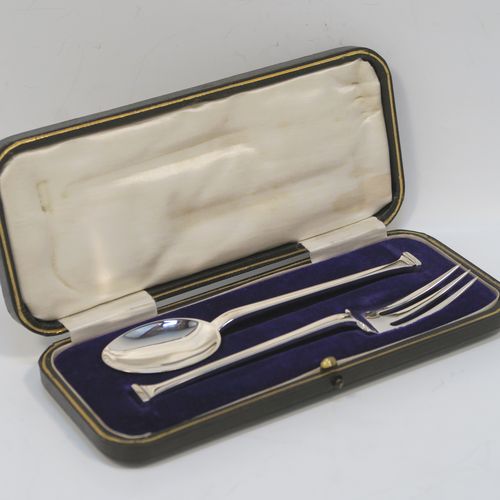 A very handsome Antique Sterling Silver christening set, having a fork and spoon in the plain Nail-End pattern, and all sitting in their original cream satin and dark blue velvet-lined presentation box. This elegant silver christening set was made by Charles Boyton and Sons of Sheffield in 1916. The dimensions of this fine hand-made antique silver christening set are length of fork 14 cms (5.5 inches), with a total weight of approx. 50g (1.6 troy ounces).   