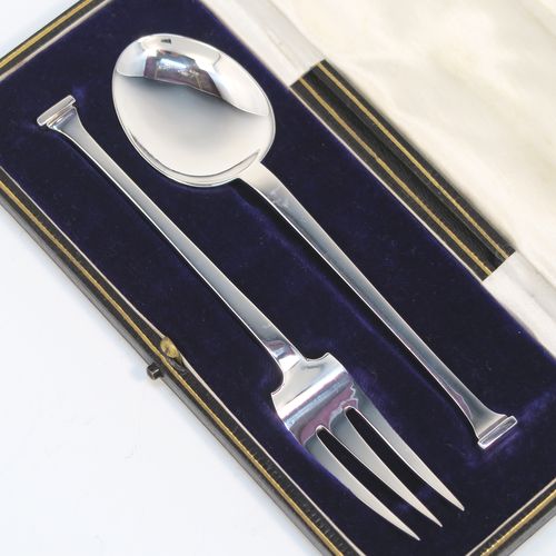 A very handsome Antique Sterling Silver christening set, having a fork and spoon in the plain Nail-End pattern, and all sitting in their original cream satin and dark blue velvet-lined presentation box. This elegant silver christening set was made by Charles Boyton and Sons of Sheffield in 1916. The dimensions of this fine hand-made antique silver christening set are length of fork 14 cms (5.5 inches), with a total weight of approx. 50g (1.6 troy ounces).