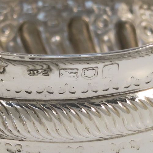A pretty Antique Edwardian Sterling Silver christening set, consisting of a two-handled porringer with hand-chased fluted decoration, together with a serving spoon, all in their blue satin and velvet-lined presentation box. The porringer was made by Henry Stratford of London in 1908, whilst the spoon was made by Thomas Bradbury of London in 1897. The dimensions of this fine hand-made silver christening set are length of spoon 14 cms (5.5 inches), diameter of bowl 10 cms (4 inches), and the total weight is approx. 172g (5.5 troy ounces).