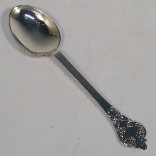 A pretty Antique Edwardian Sterling Silver christening set, consisting of a two-handled porringer with hand-chased fluted decoration, together with a serving spoon, all in their blue satin and velvet-lined presentation box. The porringer was made by Henry Stratford of London in 1908, whilst the spoon was made by Thomas Bradbury of London in 1897. The dimensions of this fine hand-made silver christening set are length of spoon 14 cms (5.5 inches), diameter of bowl 10 cms (4 inches), and the total weight is approx. 172g (5.5 troy ounces).