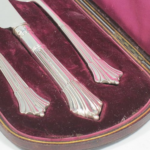 An Antique Victorian Sterling Silver christening set, having a knife, fork, and spoon, all with Albany pattern handles, and all sitting in their original purple satin and velvet-lined presentation box. Made by the William Gibson & John Lawrence of London in 1886 (for Goldsmiths & Silversmiths). The dimensions of this fine hand-made silver christening set are length of knife 20 cms (8 inches), with a total weight of approx. 125g (4 troy ounces).