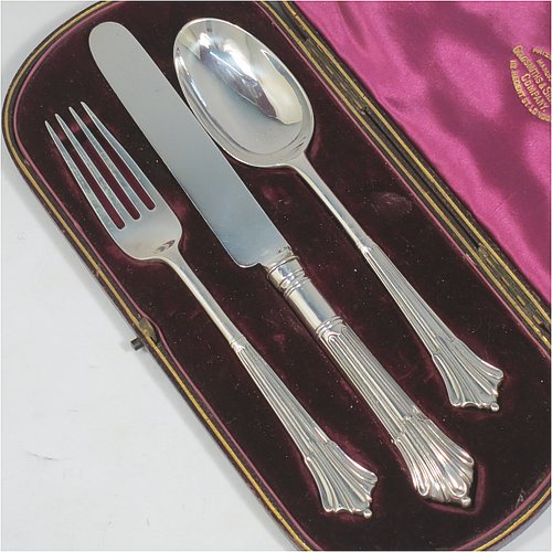 An Antique Victorian Sterling Silver christening set, having a knife, fork, and spoon, all with Albany pattern handles, and all sitting in their original purple satin and velvet-lined presentation box. Made by the William Gibson & John Lawrence of London in 1886 (for Goldsmiths & Silversmiths). The dimensions of this fine hand-made silver christening set are length of knife 20 cms (8 inches), with a total weight of approx. 125g (4 troy ounces).
