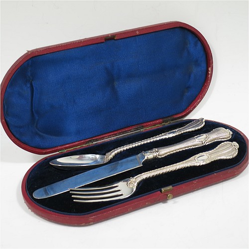 A very handsome and unusual Antique Victorian Sterling Silver christening set, having a knife, fork, and spoon, all with a cast double-struck basket-weave and rope-twist pattern, with vacant oval cartouches, and all sitting in their original dark blue satin and velvet-lined presentation box. Made by Francis Higgins of London in 1861. The dimensions of this fine hand-made antique silver christening set are length of knife 21 cms (8.25 inches), with a total weight of approx. 144g (4.6 troy ounces).    