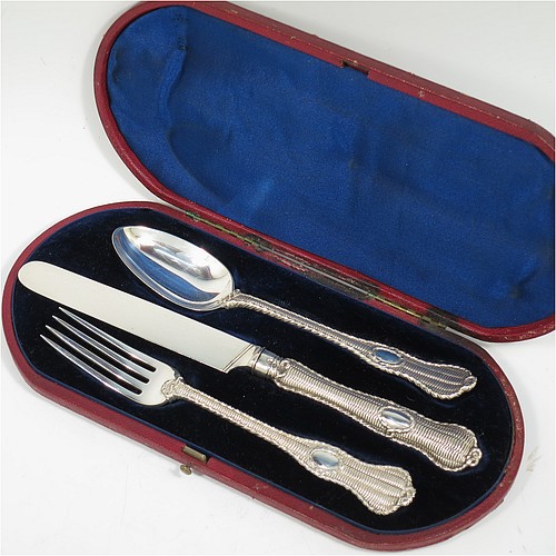 A very handsome and unusual Antique Victorian Sterling Silver christening set, having a knife, fork, and spoon, all with a cast double-struck basket-weave and rope-twist pattern, with vacant oval cartouches, and all sitting in their original dark blue satin and velvet-lined presentation box. Made by Francis Higgins of London in 1861. The dimensions of this fine hand-made antique silver christening set are length of knife 21 cms (8.25 inches), with a total weight of approx. 144g (4.6 troy ounces).