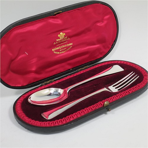 A very handsome Antique Victorian Sterling Silver christening set, having a fork and spoon, all in the plain Old English pattern, and all sitting in their original red satin and maroon velvet-lined presentation box. Made by Jackson and Fullerton of London in 1899. The dimensions of this fine hand-made antique silver christening set are length of spoon 16 cms (6.3 inches), with a total weight of approx. 60g (2 troy ounces).    