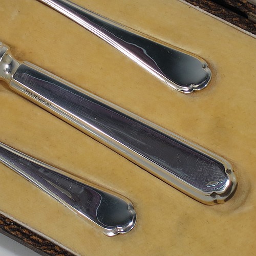 A very handsome Art Deco style Sterling Silver christening set, having a knife, fork, and spoon, all sitting in their original white satin and cream velvet-lined presentation box. Made by Walker and Hall of Sheffield in 1932. The dimensions of this fine hand-made silver christening set are length of knife 19 cms (7.5 inches), with a total weight of approx. 93g (3 troy ounces).