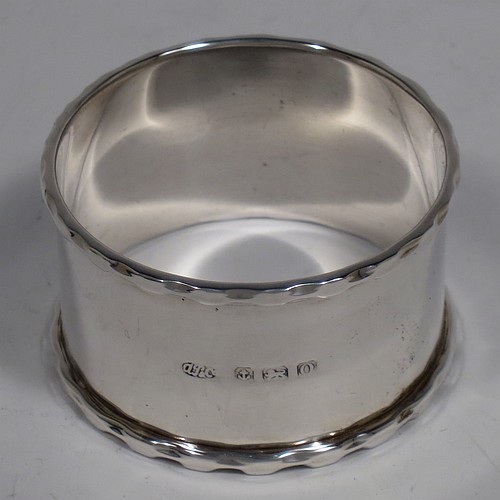 A Sterling Silver pusher, spoon, and napkin christening set, having a plain style with oval bowl, a plain pusher, and a napkin ring, all with egg and dart borders, and all sitting in their original cream satin and back velvet-lined presentation box. Made by the Arthur Price and Co. Ltd., of Birmingham in 1938. The dimensions of this fine hand-made silver christening set are length of spoon 9 cms (3.5 inches), diameter of napkin ring 4.5 cms (1.75 inches), and the total weight is approx. 53g (1.7 troy ounces).
