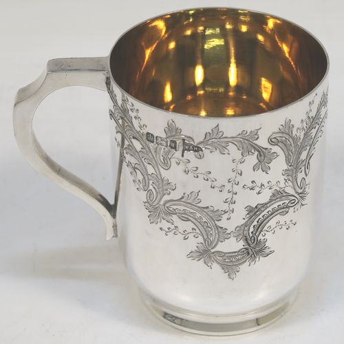 A very pretty Antique Victorian Sterling Silver christening set, consisting of a christening mug and spoon, all with hand-engraved floral decoration, and the mug with a gold-gilt interior, all sitting in an original dark and light blue satin and velvet-lined presentation box. Made by Walker and Hall of Sheffield in 1901. The dimensions of this fine hand-made antique silver christening set are length of spoon 13.5 cms (5.25 inches), height of mug 8 cms (3 inches), diameter at lip 6 cms (2.3 inches), and the total weight is approx. 175g (5.6 troy ounces).
