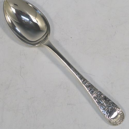A very pretty Antique Victorian Sterling Silver christening set, consisting of a christening mug and spoon, all with hand-engraved floral decoration, and the mug with a gold-gilt interior, all sitting in an original dark and light blue satin and velvet-lined presentation box. Made by Walker and Hall of Sheffield in 1901. The dimensions of this fine hand-made antique silver christening set are length of spoon 13.5 cms (5.25 inches), height of mug 8 cms (3 inches), diameter at lip 6 cms (2.3 inches), and the total weight is approx. 175g (5.6 troy ounces).
