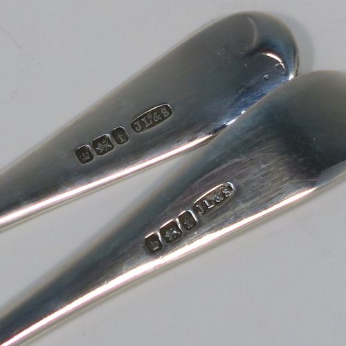 A very pretty Antique Sterling Silver christening set, having a fork and spoon in the Old English pattern, all hand-engraved on one side with a zig-zag border and stipple-work, and all sitting in their original dark blue satin and velvet-lined presentation box. This beautiful antique silver christening set was made by James Lewis and Sons of Sheffield in 1911. The dimensions of this fine hand-made antique silver christening set are length 14 cms (5.5 inches), with a total weight of approx. 47g (1.5 troy ounces)