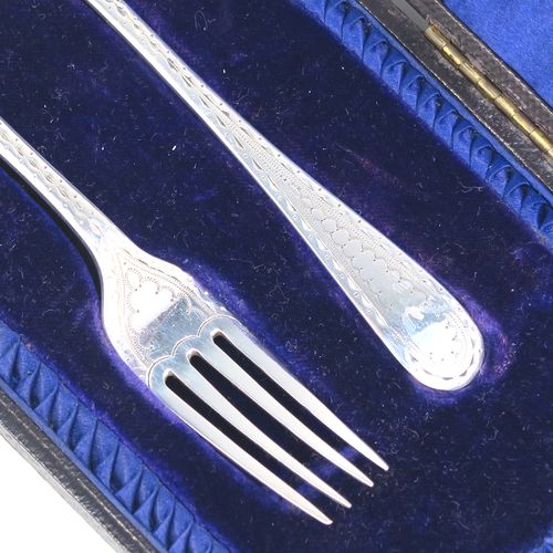 A very pretty Antique Sterling Silver christening set, having a fork and spoon in the Old English pattern, all hand-engraved on one side with a zig-zag border and stipple-work, and all sitting in their original dark blue satin and velvet-lined presentation box. This beautiful antique silver christening set was made by James Lewis and Sons of Sheffield in 1911. The dimensions of this fine hand-made antique silver christening set are length 14 cms (5.5 inches), with a total weight of approx. 47g (1.5 troy ounces)