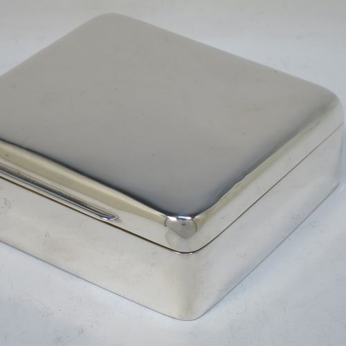 A handsome Antique Edwardian Sterling Silver cigarette / cigar table box, having a plain square body with nice rounded corners, a hinged lid with gold-gilt interior, an applied thumb-piece, and a cedar wood-lined interior to the base. Made by Elkington and Co., of Birmingham in 1907. The dimensions of this fine hand-made antique silver table cigar or cigarette box are 11 cms (4.25 inches) square and height 4 cms (1.5 inches).