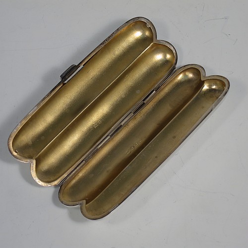A very handsome Antique Sterling Silver double cigar case, having a very plain body with a sprung hinge, a gold-gilt interior, and a catch with sprung thumb-piece. Made by Mappin and Webb of Birmingham in 1915. The dimensions of this fine hand-made antique silver double cigar case are length 14 cms (5.5 inches), width 5 cms (2 inches), depth 2 cms (0.75 inch), and it weighs approx. 99g (3 troy ounces).