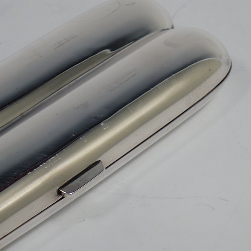 A very handsome Antique Sterling Silver double cigar case, having a very plain body with a sprung hinge, a gold-gilt interior, and a catch with sprung thumb-piece. Made by Mappin and Webb of Birmingham in 1915. The dimensions of this fine hand-made antique silver double cigar case are length 14 cms (5.5 inches), width 5 cms (2 inches), depth 2 cms (0.75 inch), and it weighs approx. 99g (3 troy ounces).