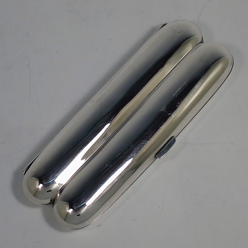A very handsome Antique Sterling Silver double cigar case, having a very plain body with a sprung hinge, a gold-gilt interior, and a catch with sprung thumb-piece. Made by Mappin and Webb of Birmingham in 1915. The dimensions of this fine hand-made antique silver double cigar case are length 14 cms (5.5 inches), width 5 cms (2 inches), depth 2 cms (0.75 inch), and it weighs approx. 99g (3 troy ounces).
