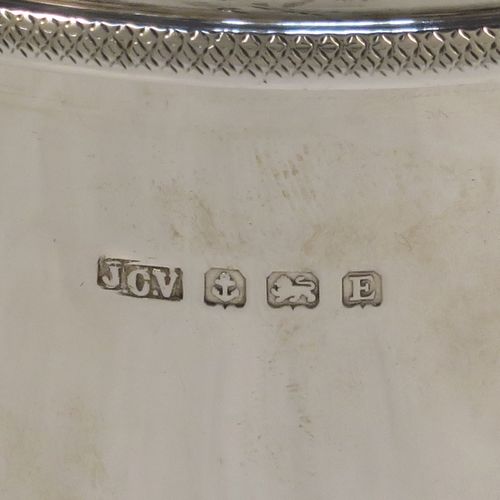 A very handsome Sterling Silver Art Deco cocktail shaker, having a plain round body with tapering sides, with a pull-off lid and interior strainer section, and an applied knurled edge to the main body. This elegant silver cocktail shaker was made by J. C. Vickery of Birmingham in 1929. The dimensions of this fine hand-made silver cocktail shaker are height 20 cms (8 inches), diameter at widest point 9 cms (3.5 inches), and it weighs approx. 340g (11 troy ounces).  