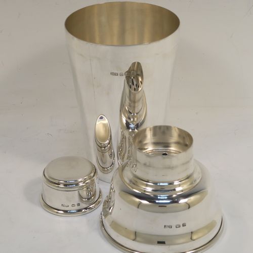 A very handsome Sterling Silver Art Deco cocktail shaker, having a plain round body with tapering sides, with a pull-off lid and interior strainer section, and an applied knurled edge to the main body. This elegant silver cocktail shaker was made by J. C. Vickery of Birmingham in 1929. The dimensions of this fine hand-made silver cocktail shaker are height 20 cms (8 inches), diameter at widest point 9 cms (3.5 inches), and it weighs approx. 340g (11 troy ounces).  