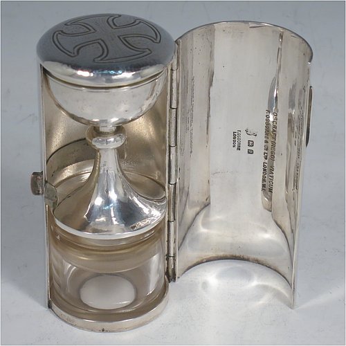 A rare Sterling Silver three-piece travelling communion set consisting of a hand-hammered chalice, pyx box with lid, and glass wine holder with stopper, all in their original silver cylindrical hinged travelling box with a hand-chased christogram. Made by Frederick Osborne & Co., of London in 1930. The dimensions of this fine hand-made silver travelling communion set are length of box 9.5 cms (3.75 inches), and diameter 4.5 cms (1.75 inches), and with a total weight of approx. 250g (8 troy ounces). Please note that it is very unusual to find an original pyx box in a travelling communion set.