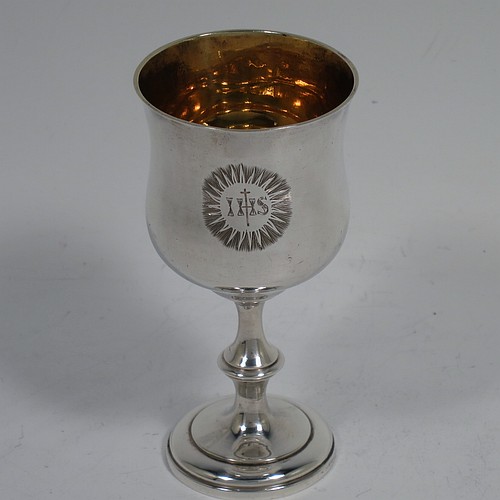 An Antique early Victorian Sterling Silver three-piece travelling communion set consisting of chalice, paten, and wine bottle. The chalice having a plain round bellied body, a gold-gilt interior, and sitting on a pedestal foot. The paten having a round body with an applied reeded and shaped border, and sitting on a collet foot. The wine bottle having a plain rectangular body with cut-corners and round screw-off lid, with a crystal stopper. All three pieces are hand-engraved with a Christogram, and they are all sitting in their original maroon velvet-lined presentation box. Made by John Evans II of London in 1844. The dimensions of this fine hand-made antique silver travelling communion set are height of chalice 9 cms (3.5 inches), diameter of paten 6.5 cms (2.5 inches), length of bottle 8cms (3.25 inches), and with a total weight of approx. 131g (4.2 troy ounces).