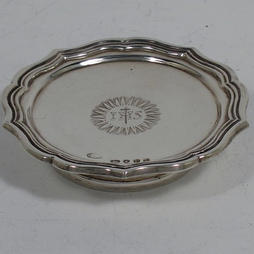 An Antique early Victorian Sterling Silver three-piece travelling communion set consisting of chalice, paten, and wine bottle. The chalice having a plain round bellied body, a gold-gilt interior, and sitting on a pedestal foot. The paten having a round body with an applied reeded and shaped border, and sitting on a collet foot. The wine bottle having a plain rectangular body with cut-corners and round screw-off lid, with a crystal stopper. All three pieces are hand-engraved with a Christogram, and they are all sitting in their original maroon velvet-lined presentation box. Made by John Evans II of London in 1844. The dimensions of this fine hand-made antique silver travelling communion set are height of chalice 9 cms (3.5 inches), diameter of paten 6.5 cms (2.5 inches), length of bottle 8cms (3.25 inches), and with a total weight of approx. 131g (4.2 troy ounces).