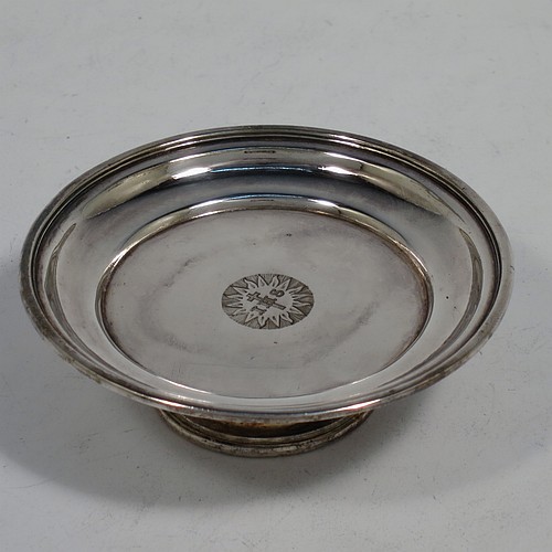 An Antique Victorian silver-plated three-piece travelling communion set consisting of a chalice, paten, and wine bottle. The chalice having a plain round body, a gold-gilt interior, and sitting on a pedestal foot. The paten having a round body with a reeded border, and sitting on a collet foot. The wine bottle having a plain round screw-off lid, an original glass stopper, and the glass body with hand-cut panelled decoration. The chalice and paten are engraved with a Christogram, and all sit in their original blue velvet-lined presentation box. Made in ca. 1890. The dimensions of this fine hand-made antique silver plated travelling communion set are height of chalice 7.5 cms (3 inches), diameter of paten 8 cms (3 inches), and height of wine bottle 8.5 cms (3.3 inches).